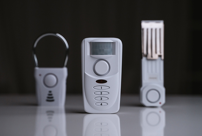 SABRE products in a row. Window, keypad alarm, and door stopper.